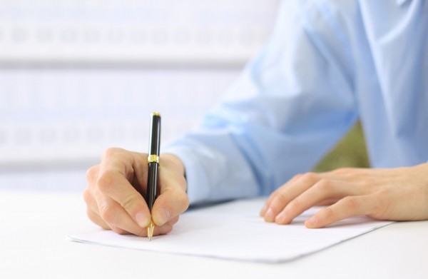 depositphotos_5046909-stock-photo-hands-writing-on-a-paper