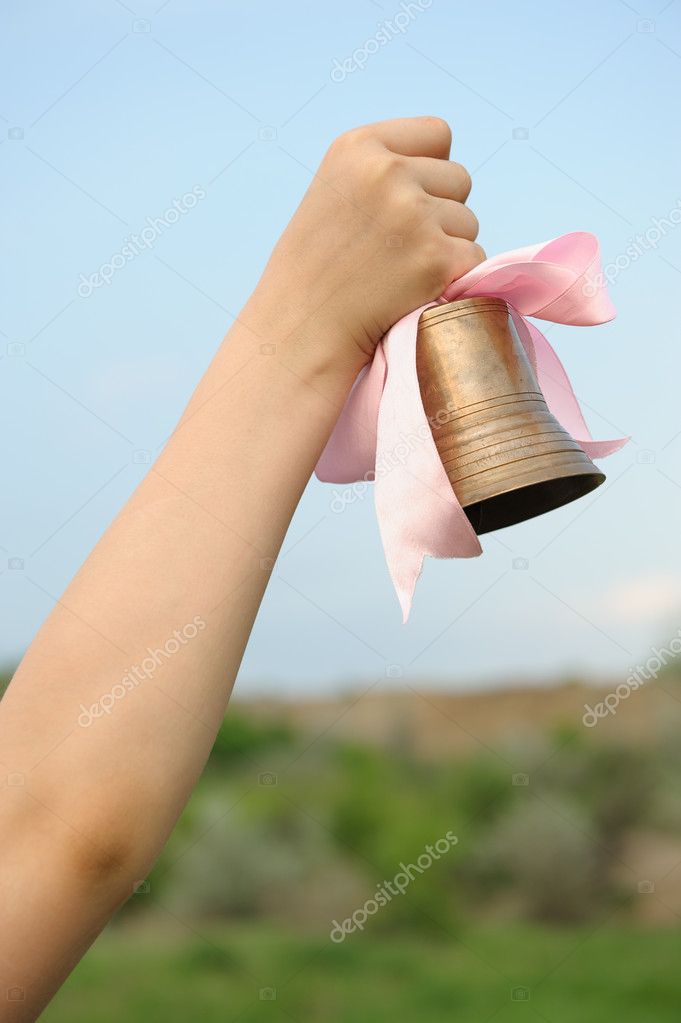 depositphotos_10503597-stock-photo-the-hand-with-a-bell